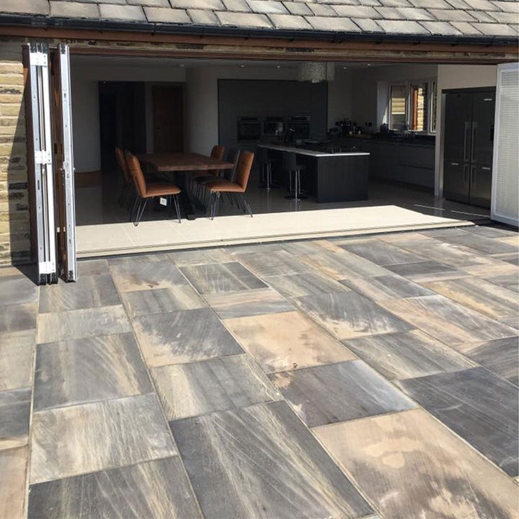 How do I remove the mud stains from my new porcelain patio tiles?